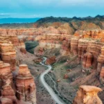Charyn Canyon red sandstone formations and the road through the Valley of Castles